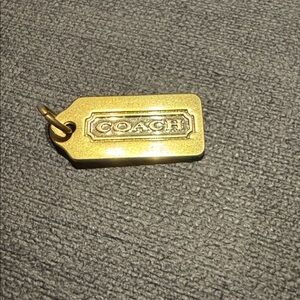 Coach GOLD BRASS color hang tag
